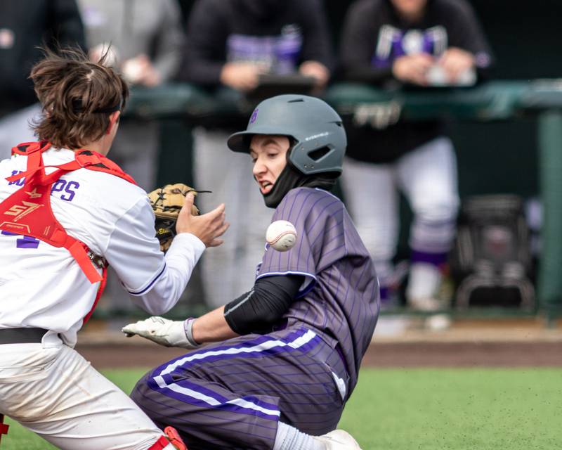 Hampshire's Jack Reynolds (7) beats the throw at the plate during baseball game between Dixon at Hampshire.  March 28, 2024