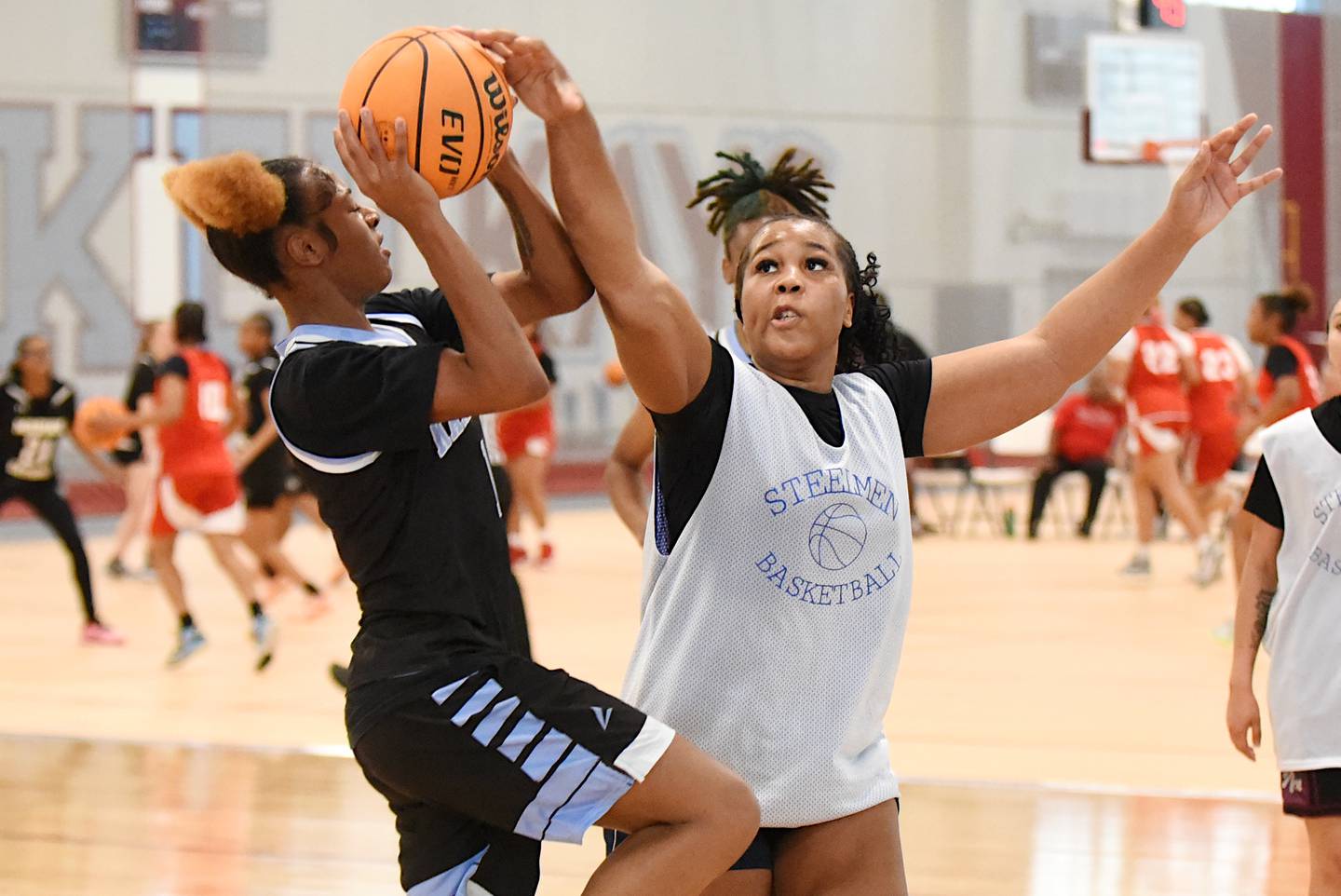 Joliet Central's Taneisha Robinson, right, defends a shot from Kankakee's Ki'Asia Wilson during a game at the Kankakee Live event at the Genevra Walters Community Center Saturday, June 14, 2025.