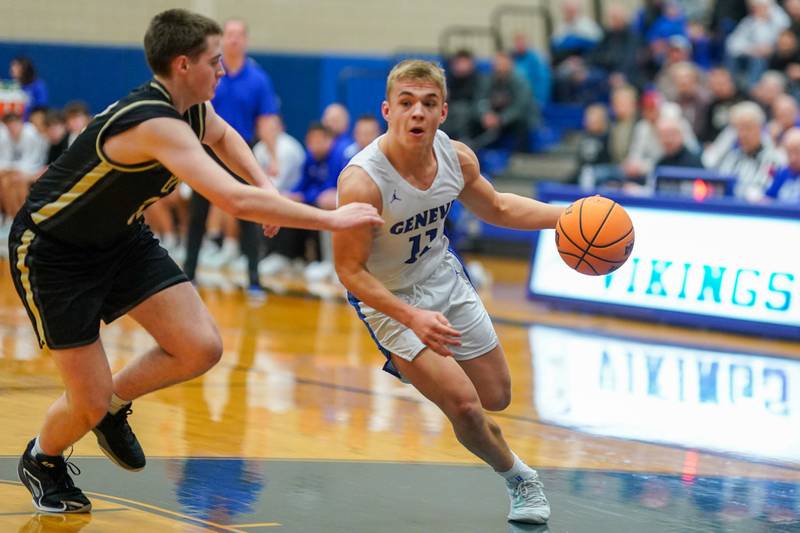 Geneva’s Nelson J Wendell (11) drives to the basket against Glenbard North's Matt Welch (32) during a class 4A Geneva Regional final basketball game at Geneva High School on Friday, Feb. 28, 2025.