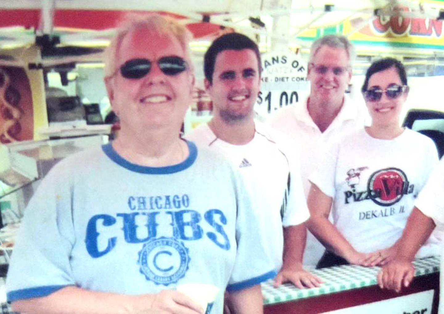 Larry Finn, co-owner of Pizza Villa in DeKalb, died unexpectedly at age 76 on Tuesday, Dec. 14, 2021. (From left to right): Larry Finn, nephew CJ Finn, brother John Finn at DeKalb Corn Fest in the early 2010s (Photo provided by CJ Finn).