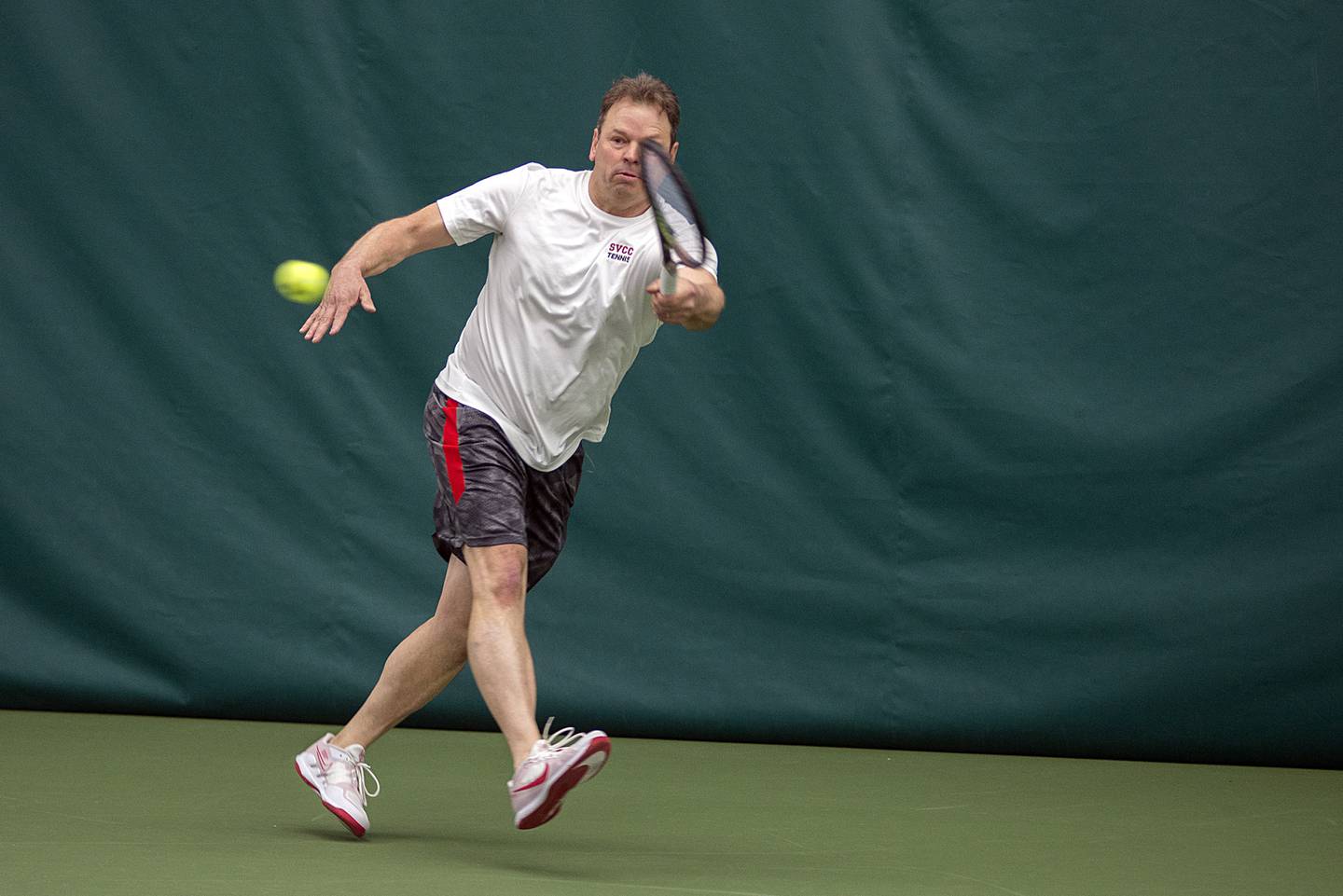 Sauk Valley College's Corey Engel returns a shot during a doubles match with son Preston Saturday, April 2, 2022 at Westwood in Sterling. The father-son duo took on Milwaukee Area Tech's Josh Zaborski and Tim Haspel.