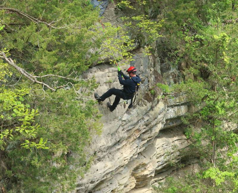 Ottawa firefighter Brazen Wheeler climbs down the side of a cliff during rope rescue training on Saturday, May 2, 2026 in Wildcat Canyon at Starved Rock State Park.