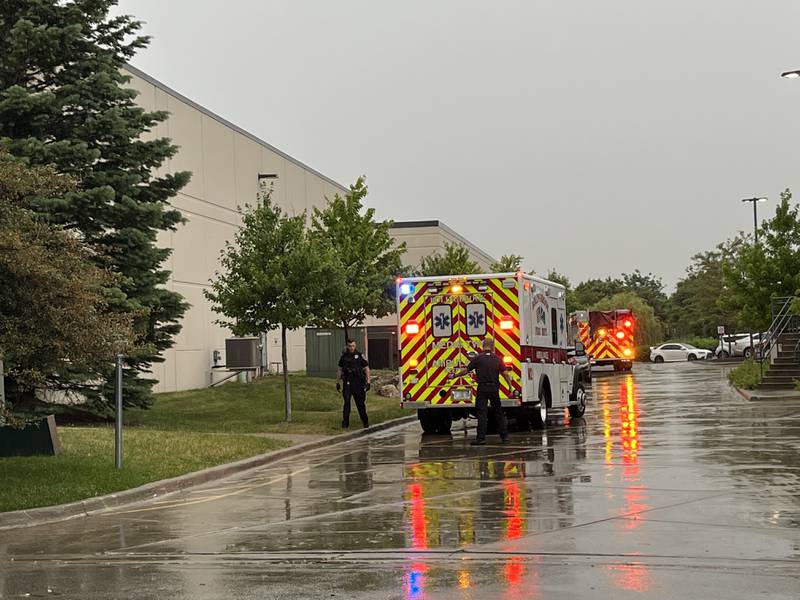 An ambulance responds to a building at the WeatherTech complex in Bolingbrook on Saturday, June 25, 2022. Police said three people were shot.