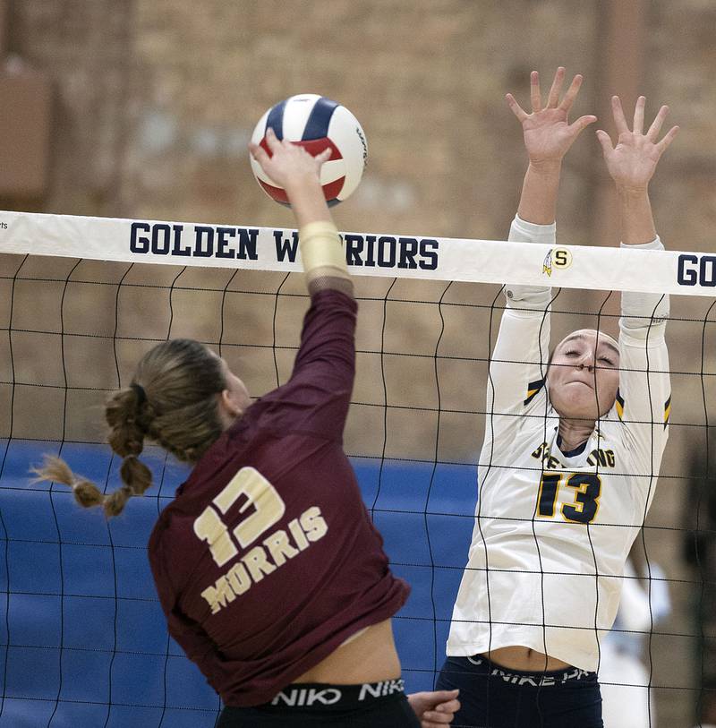 Sterling’s Sydney Giffin goes up for a block against Morris’s Tessa Shannon Thursday, Oct. 30, 2025, in the Class 3A volleyball regional.