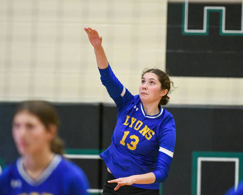 Lyons Township's Taylor Carroll (13) serves the ball during the game on Thursday Oct. 30, 2025, while taking on York in the regional title game held at York High School.