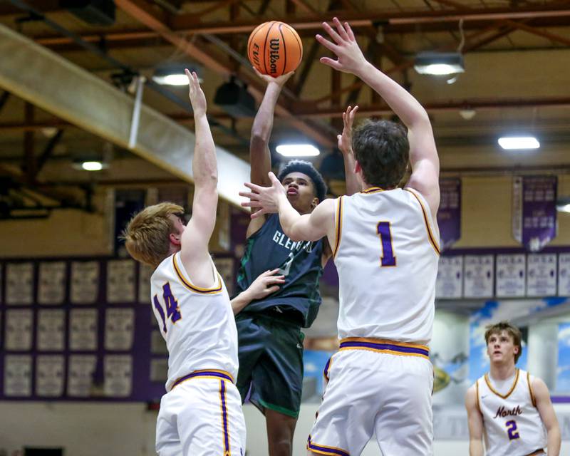 Glenbard West's TJ Williams (3) puts up a shot during their basketball game between Glenbard West at Downers Grove North. Jan 24, 2025 in Downers Grove.