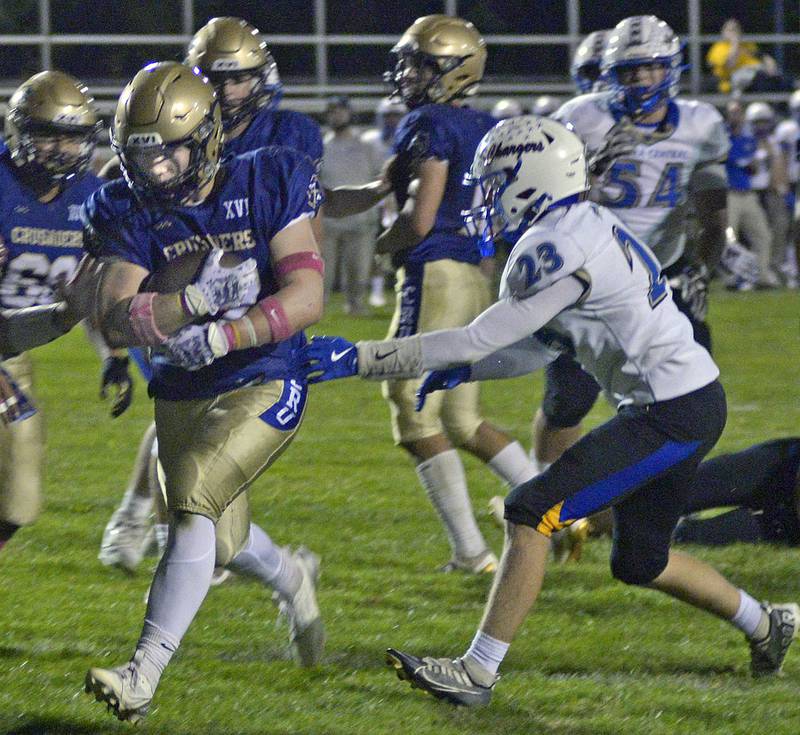 Marquette’s Grant Dose scampers into the end zone ahead of Aurora Central Christian’s Aiden Crisco in the 1st quarter Friday at Marquette.