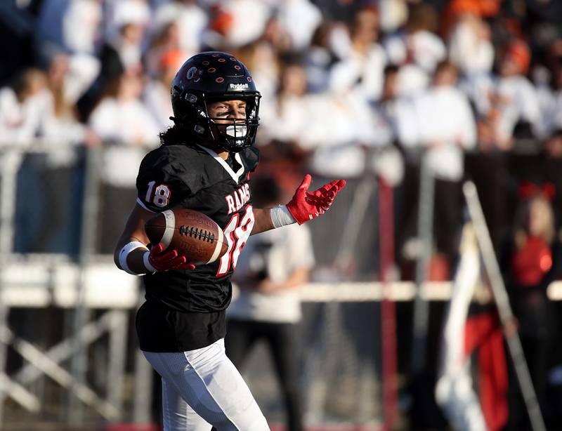 Glenbard East's Chris Renford (18) celebrates a touchdown during the IHSA Class 7A quarterfinals Saturday November 11, 2023 in Lombard.