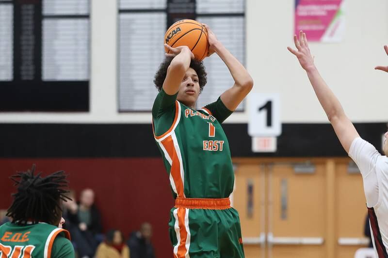 Plainfield East’s Kierre Miller takes an outside shot against Plainfield North on Tuesday, Dec. 9, 2025 in Plainfield.