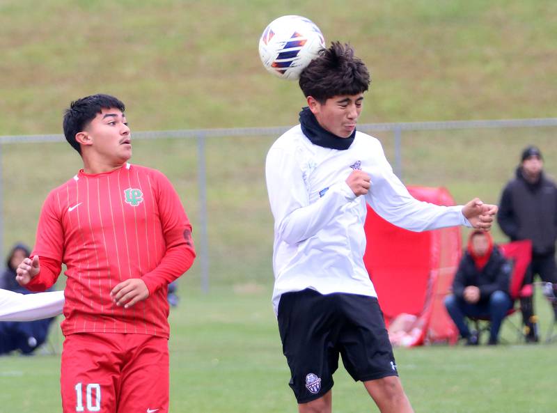 Kankakee's Sergio Vargas puts a header on the ball over L-P's Isamael Mejia during the Class 2A Regional title game on Saturday, Oct. 25, 2025 at Ottawa High School.