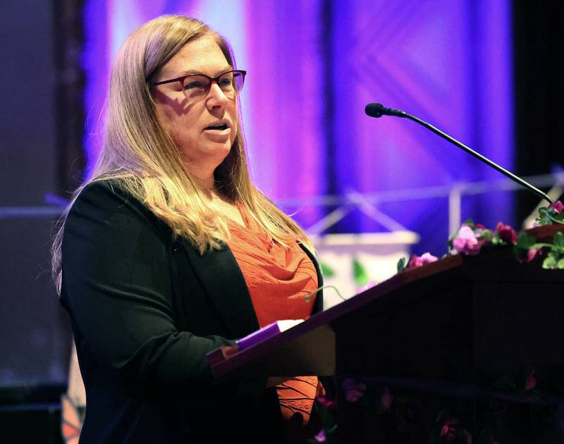 Rebecca Versluys, executive director of Safe Passage, speaks during their Candlelight Vigil and Survivor Speak Out Monday, Oct. 6, 2025, at the Egyptian Theatre in DeKalb.