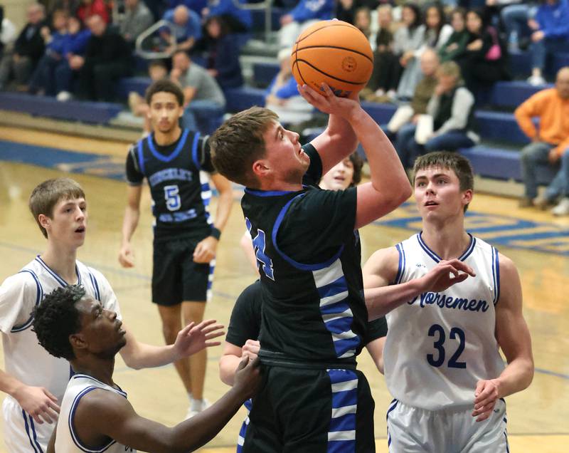 Hinckley-Big Rock's Austin Roop gets a shot up in front of Newark's Cody Kulbartz Friday, Feb. 6, 2026, during their Little 10 Conference third place game at Somonauk High School.