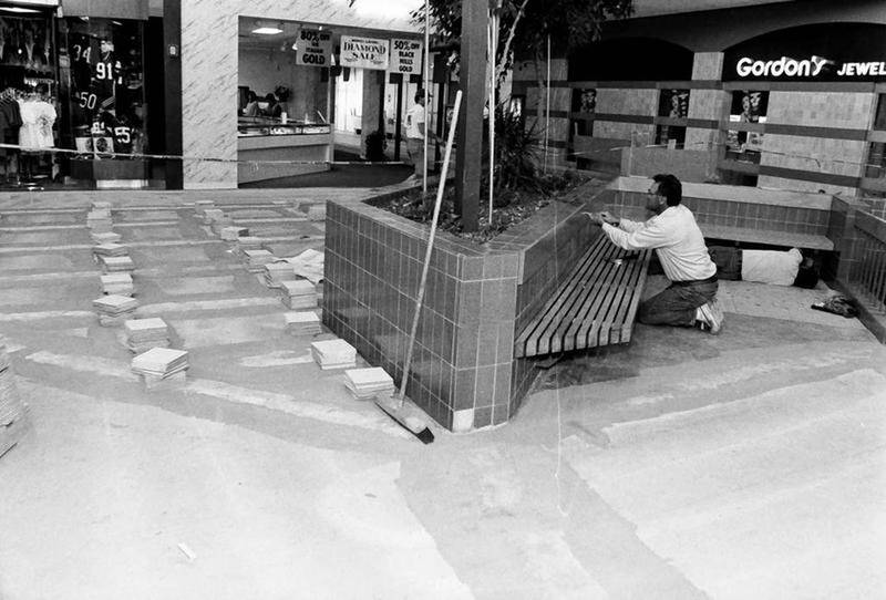 A worker installs tile at the north end of the Peru Mall in 1989.