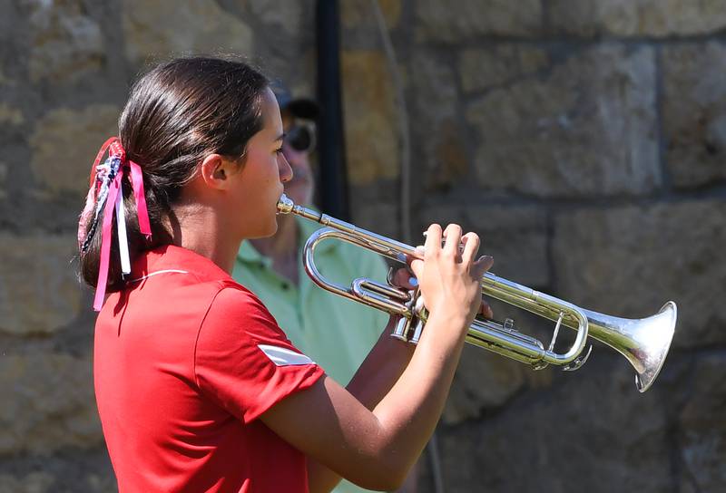 Oregon High School band member Sarah Eckardt plays taps during Oregon's Memorial Day Service on Monday, May 25, 2026 at the Riverside Cemetery. Eckardt and Cole Hoversten both played trumpets to create "Echo Taps" with the buglers standing some distance apart to achieve an echo effect.