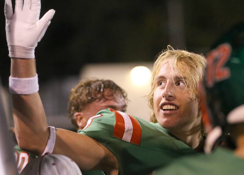 L-P's Mason Morscheiser hi-fives teammates after running back a touchdown after a fumble against Kaneland on Friday, Oct. 17, 2025 at Howard Fellows Stadium.