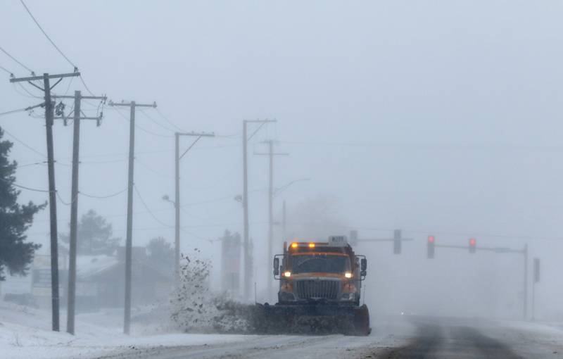 An Illinois Department of Transportation snowplow removes snow from Route 173 near Wilmot Road on Thursday, Feb. 16, 2023, in Spring Grove after a winter storm moved through McHenry County creating hazardous driving conditions.