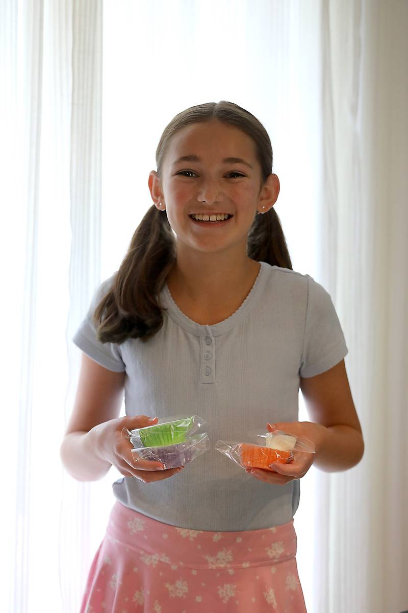 Tenlee Pedersen with some of the bath bombs she makes to sell on Thursday, July 31, 205, and her home near Union. She is one of several young entrepreneurs who will be taking part in a junior market will launch for the first time at the Huntley Farmers Market.