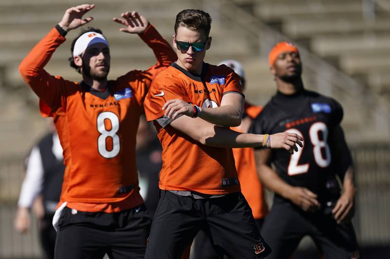 Cincinnati Bengals quarterback Joe Burrow (9) quarterback Brandon Allen, (8) and running back Joe Mixon (28) warm up during NFL football practice Friday, Feb. 11, 2022, in Los Angeles. The Cincinnati Bengals play the Los Angeles Rams in the Super Bowl Sunday Feb. 13. (AP Photo/Marcio Jose Sanchez)