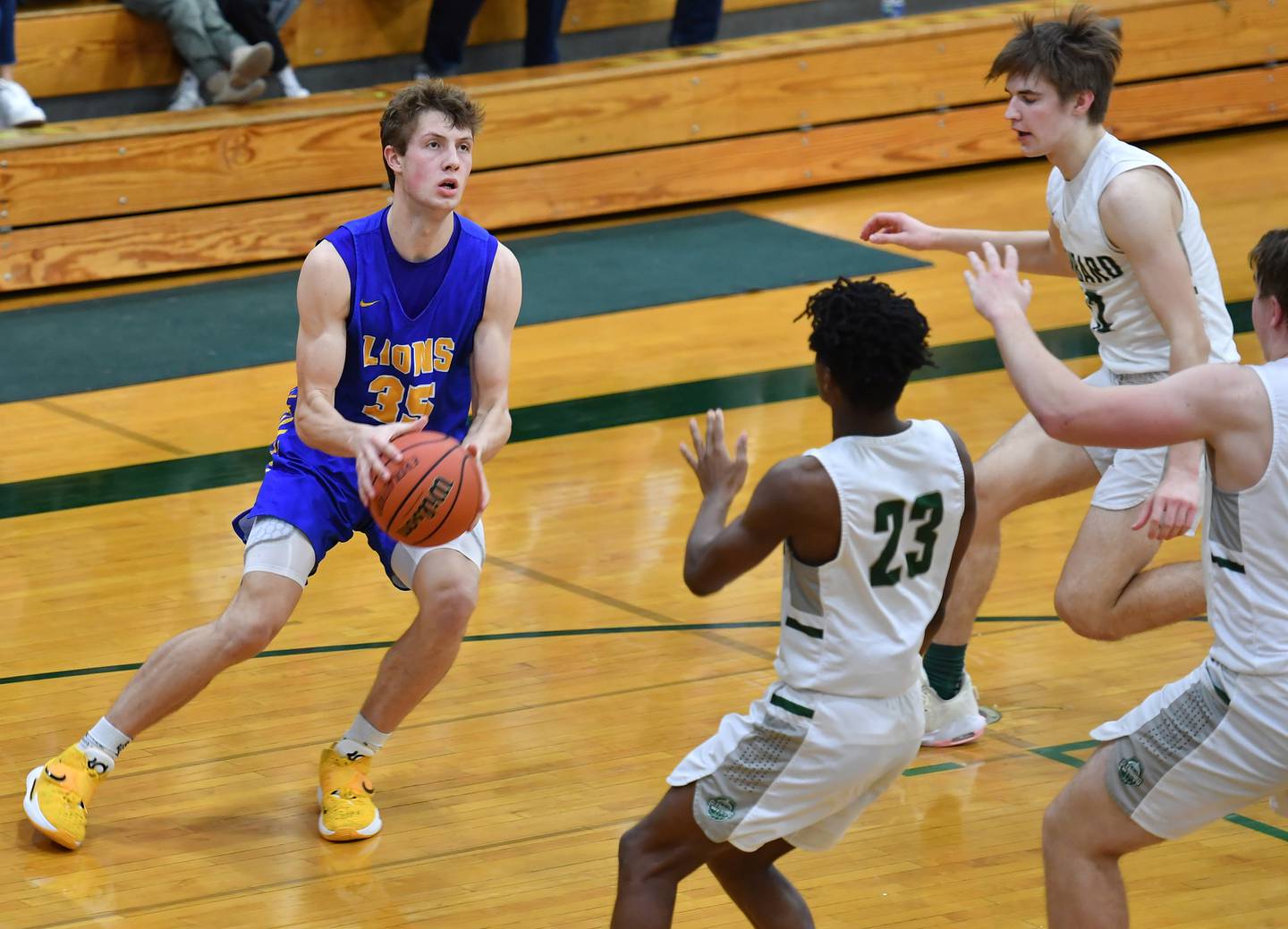 Lyons Township's Niklas Polonowski (35) looks to shoot as the Glenbard West defense closes in during a game on Dec. 10, 2022 at Glenbard West High School in Glen Ellyn.