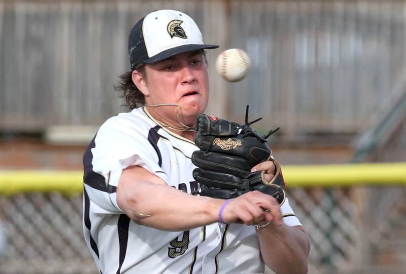 Sycamore's Matthew Rosado throws the ball to first after a comebacker during their game against Kaneland Monday, April 22, 2024, at the Sycamore Community Sports Complex.