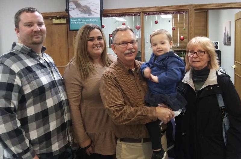 Terry McEvilly, the 2021 Heart of Our Community Award winner, is pictured with his family. The presentation was made during Heartland Bank and Trust Company's annual Business After Hours event.