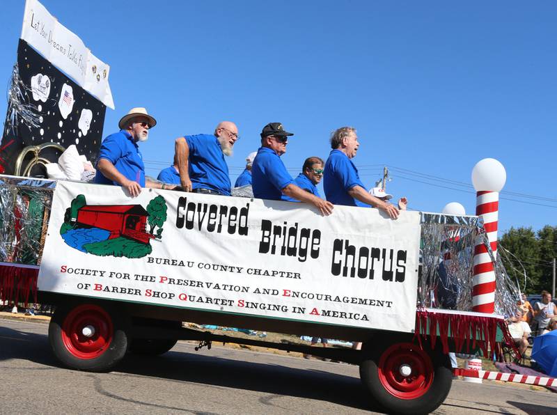The Covered Bridge Chorus rides on a hayrack during the 52nd annual Homestead Festival parade on Saturday, Sept. 9, 2023 in Princeton.