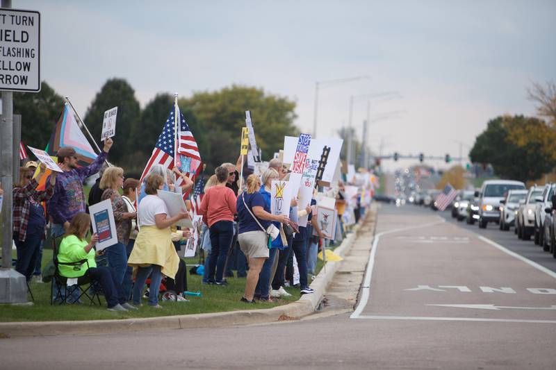 Locals gather at the NO Kings rally along Randall Rd. on Saturday, Oct.18,2025 in Geneva.