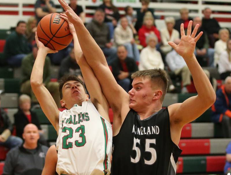 L-P's Nicholas Olivero eyes the hoop while being heavily guarded by Kaneland's Jake Buckley on Tuesday, Dec. 12, 2023 in Sellett Gymnasium.