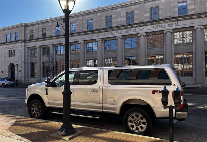 Former GOP state Sen. Sam McCann’s pickup truck – the same make and model of a truck named as an illicit purchase in his indictment – is parked outside of the Paul Findley Federal Courthouse in Springfield, where McCann was supposed to have faced a corruption trial this week. Instead, he checked himself into the hospital over the weekend and his trial was delayed until Monday. The judge in the case ordered McCann detained Friday until the trial’s new start date, accusing McCann of making “excuses.”