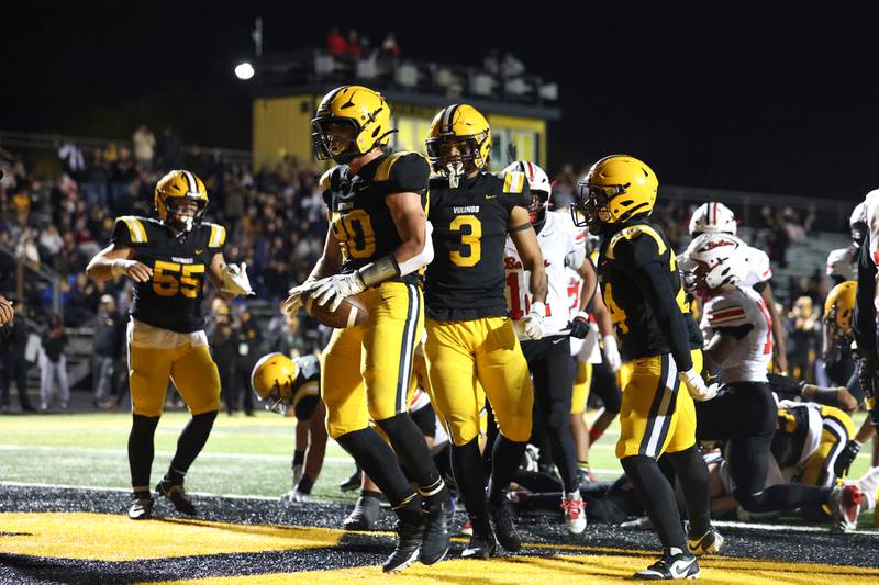 St. Laurence's Cory Les (80) celebrates a touchdown against Bradley-Bourbonnais during the Vikings 35-21 victory over Bradley-Bourbonnais in second round playoff on Friday, Nov. 7, 2025.