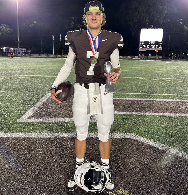 Mount Carmel's Emmett Dowling threw for 272 yards and accounted for five touchdowns during the Caravan's 35-14 win over St. Rita on Friday night.