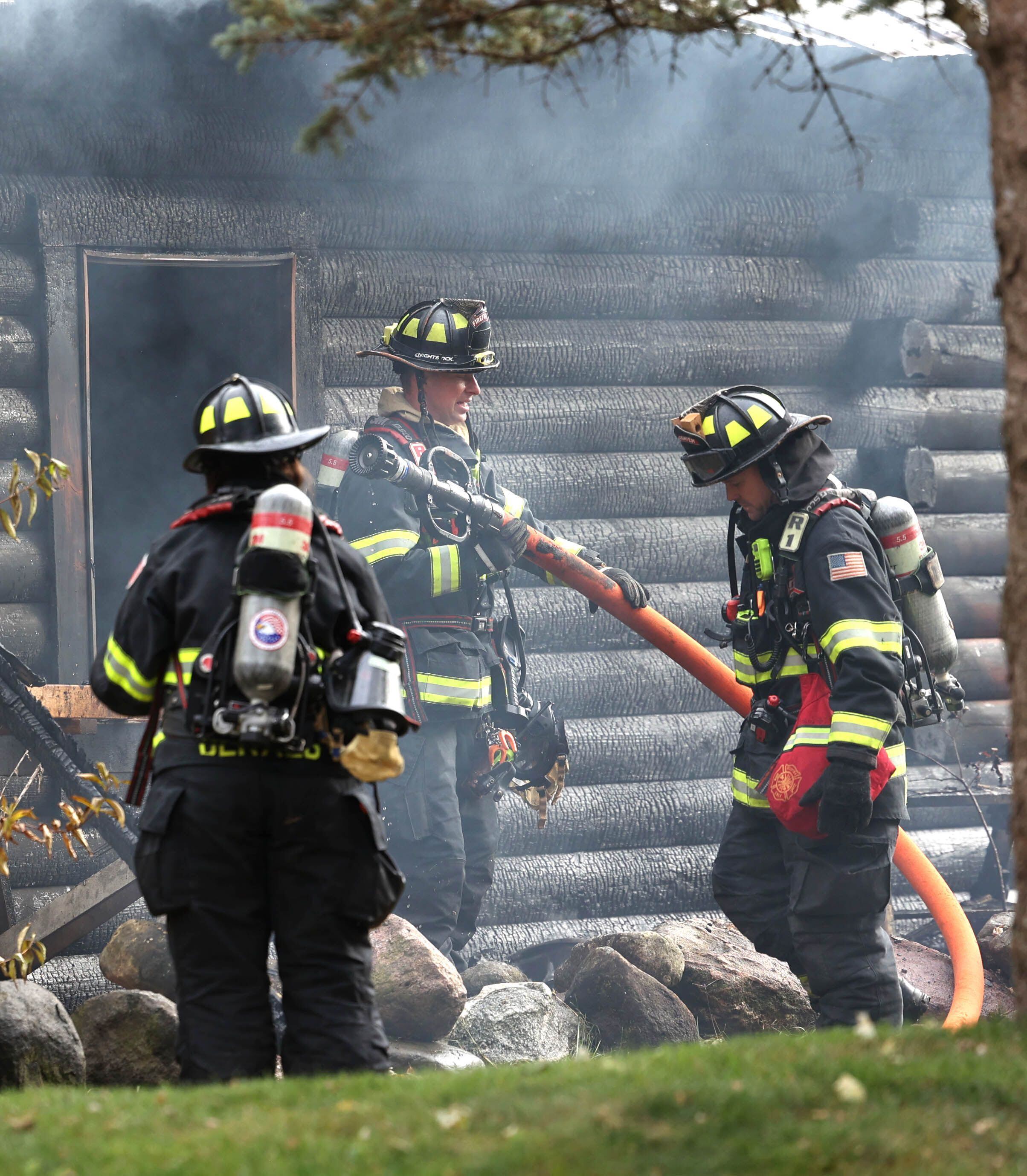 DeKalb firefighters prepare to put water on a house that was destroyed by fire Thursday, Nov. 13, 2025, near Shabbona Grove Road in Shabbona. Several local departments responded to the general alarm structure fire.