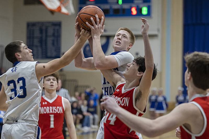 Newman’s George Jungerman works below the basket against Morrison’s Cooper Bush Wednesday, Jan. 3, 2024 at Newman High School.