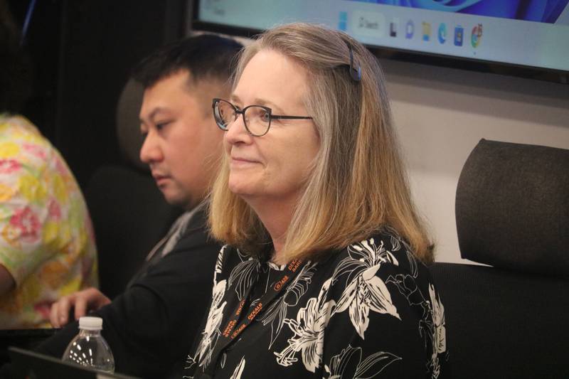 Cindy Carpenter, DeKalb District 428's director of business and finance, is celebrated by the DeKalb District 428 school board at its June 6, 2023 meeting. Carpenter is retiring from her post after 17 years.