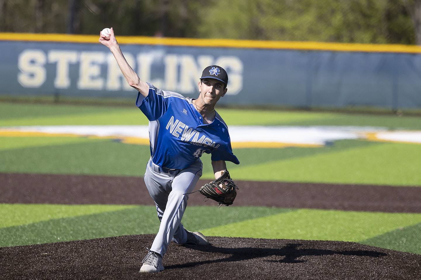 Newman’s Kyle Wolfe fires a pitch against Sterling Wednesday, May 3, 2023.