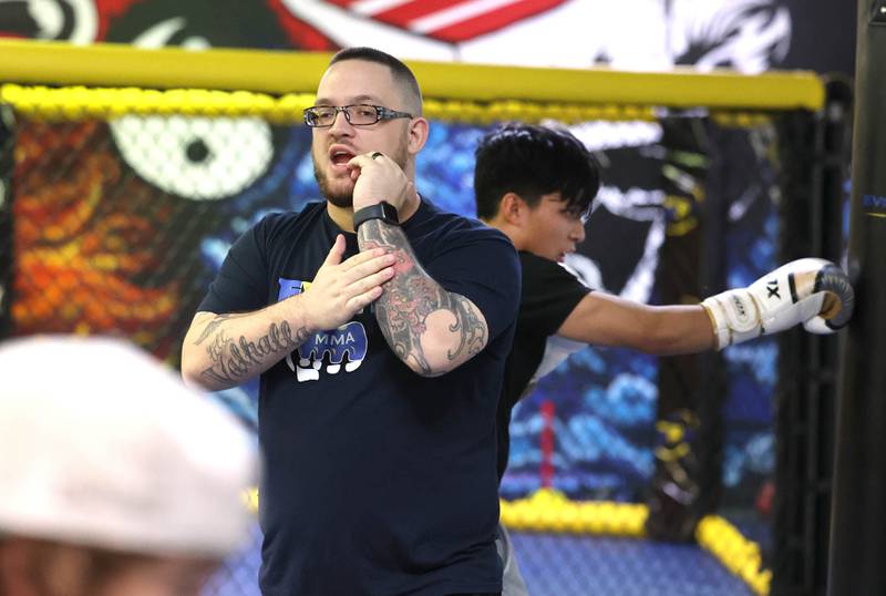 Joe Judkins, head coach at Evolve MMA and Powerlifting, gives some pointers during a class Thursday, Nov. 9, 2023, at the facility in DeKalb.