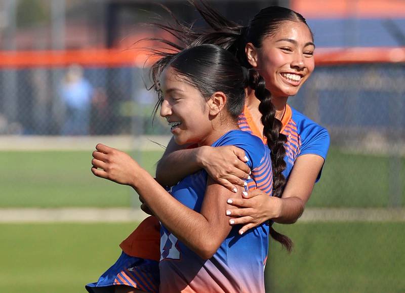 Genoa-Kingston's Nayelli Gonzalez (left) is hugged after scoring a goal by teammate Gisselle Abonce Thursday, April 23, 2026, during their game against North Boone at Genoa-Kingston High School.