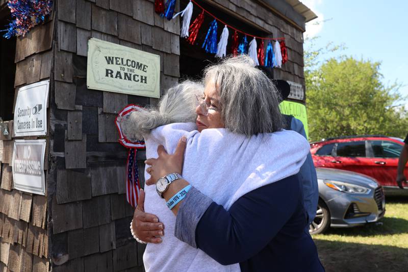 Nina Latting, of St. Anne, hugs a friend as they arrive to the 50th Pembroke Rodeo, hosted by Latting Rodeo Productions on Sunday, May 24, 2026. Nina's husband, Mike, owns the St. Anne-based rodeo company he inherited from his father, Thyrl.