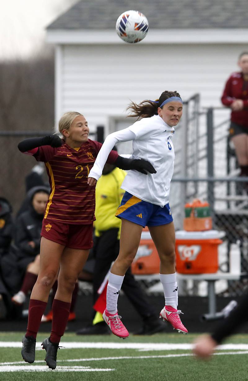 Richmond-Burton's Blake Frericks battles with Johnsburg's Elizabeth Smith for the ball during a Kishwaukee River Conference soccer game on Tuesday, April 1, 2025, at Richmond-Burton High School.