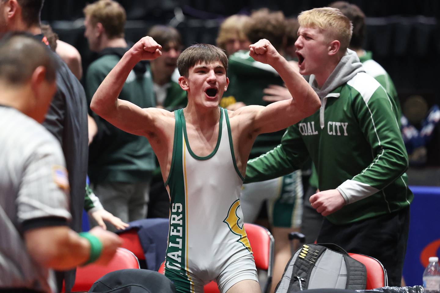 Coal City’s Brody Widlowski celebrates his team clinching win over Yorkville Christian’s Eli Foster in the 113-pound match for the Class 1A dual team championship on Saturday, Feb. 25, 2023, at Grossinger Motors Arena in Bloomington.