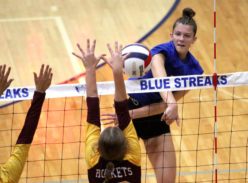 Woodstock’s Hallie Steponaitis sends the ball over the net against Richmond-Burton in varsity volleyball at Woodstock Monday night.