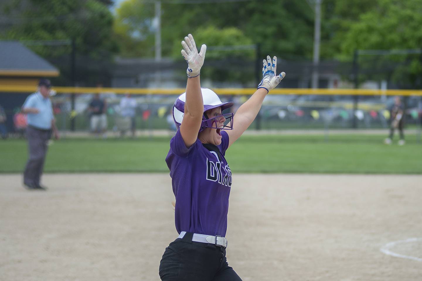 Dixon’s Sam Tourtillott celebrates teammate Izzy McCommons game tying home run Saturday, May 28, 2022 against Sterling.