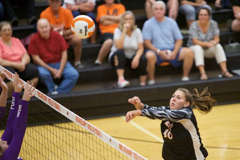 McHenry's Lynette Alsot with the return volley against Hampshire on Tuesday, Sept. 6,2022 in McHenry.