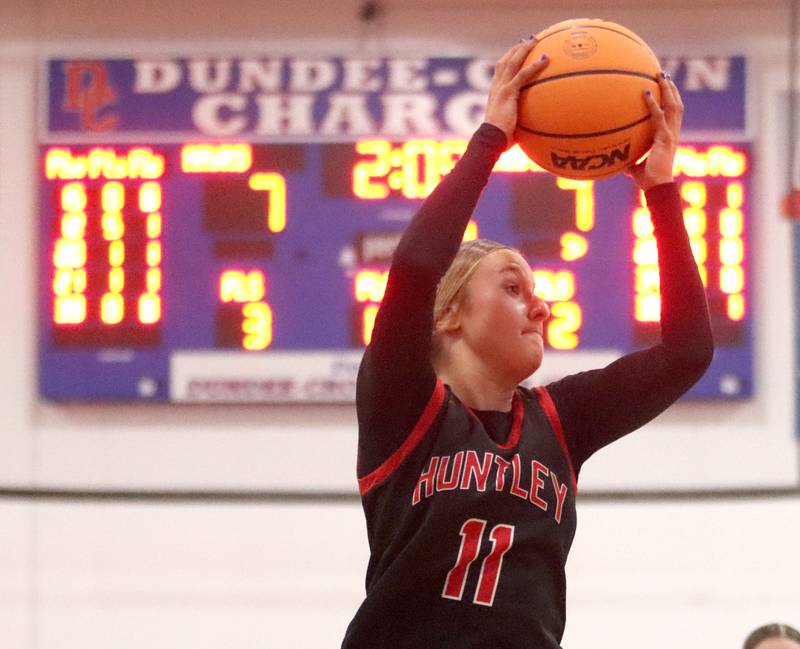 Huntley’s Anna Campanelli works under the hoop against Maine South in Komaromy Holiday Classic varsity girls basketball championship game action on Monday, Dec. 30, 2024, at Dundee-Crown High School in Carpentersville.