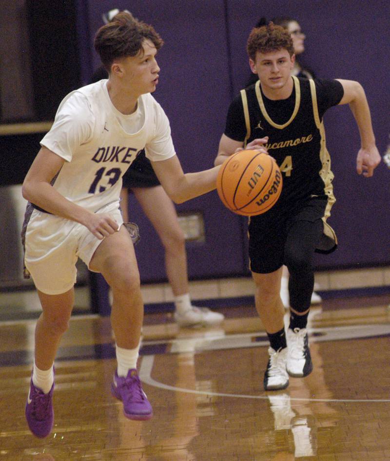 Dixon's Beckham Rock brings the ball up followed by Sycamore's Chase Miller. The Dixon Dukes hosted  the Sycamore Spartans in a non-conference game  on Friday, December 19th, 2025.