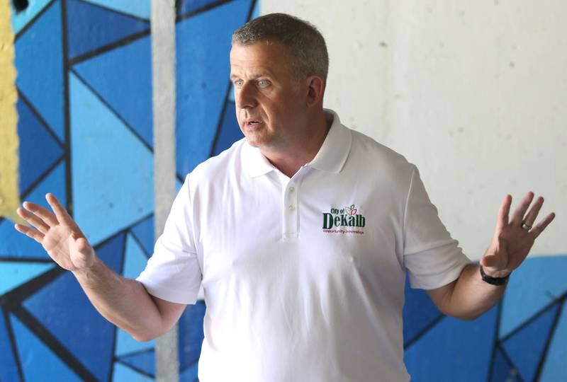 DeKalb Mayor Cohen Barnes speaks prior to the ribbon cutting Friday for the Unity mural on the underpass below Lincoln Highway near Northern Illinois University. The mural was painted by four local artists, Aaron Robertson, Ivy Vargas, Jordan Jacob, and Shannon Gallagher.