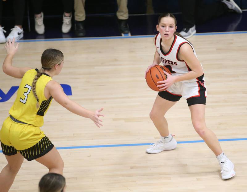 Amboy's Elly Jones looks to pass the ball around Putnam County's Gabby Doyle during the Class 1A Regional semifinal game on Monday, Feb. 12, 2024 at Marquette High School.