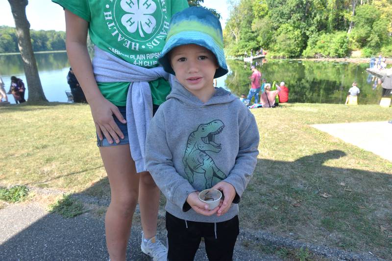 Connor Temple, 4, of Fulton, caught a teeny minnow during the Whiteside County Sheriff Office and Mounted Patrol's annual fishing derby at Morrison-Rockwood State Park in Morrison on Saturday, Sept. 9, 2023. His sister Katelyn, 13, was helping her brother report the fish.