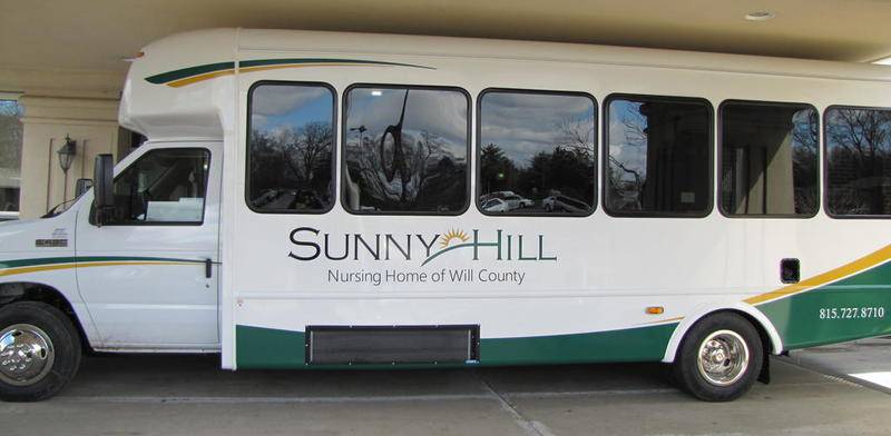Residents who wished to be on the first ride – around the Sunny Hill and Health Department campus – were asked to sign up for a lottery. All of the residents who attended the reception put their names in for the April 6 ride.

The bus will be on display at the County Office Building May 17 when residents attend the regularly scheduled County Board meeting to present the title and keys to the county.

Anyone who still would like to help, may send a check to The Friends of Sunny Hill, Inc., at Sunny Hill Nursing Home of Will County, 421 Doris Ave., Joliet, 60433.

Above, The 2018 Ford bus replaces a 2004 model. The new bus has places for two additional wheelchairs and has additional heating vents.