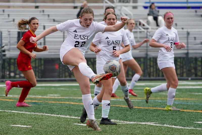 Oswego East's Emma Petrak (22) clears the ball during a soccer match against Batavia at Batavia High School on Saturday, March 29, 2025.